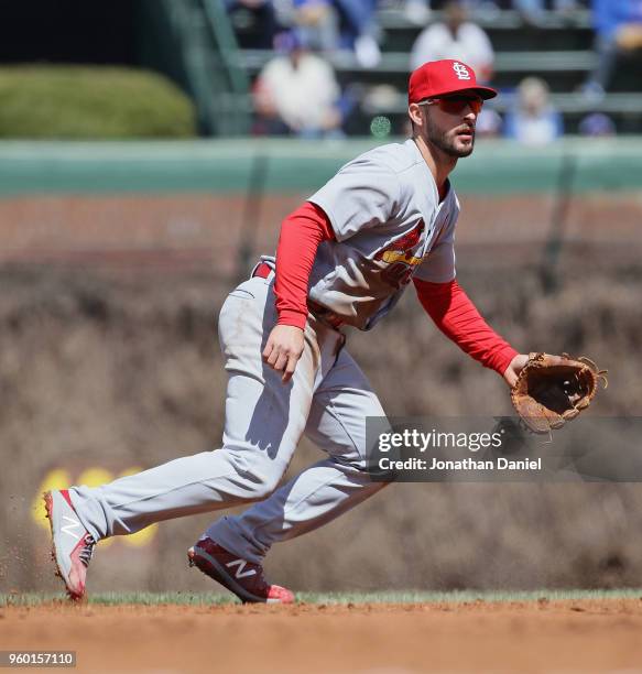 Paul DeJong of the St. Louis Cardinals moves to the ball against the Chicago Cubs at Wrigley Field on April 19, 2018 in Chicago, Illinois. The Cubs...