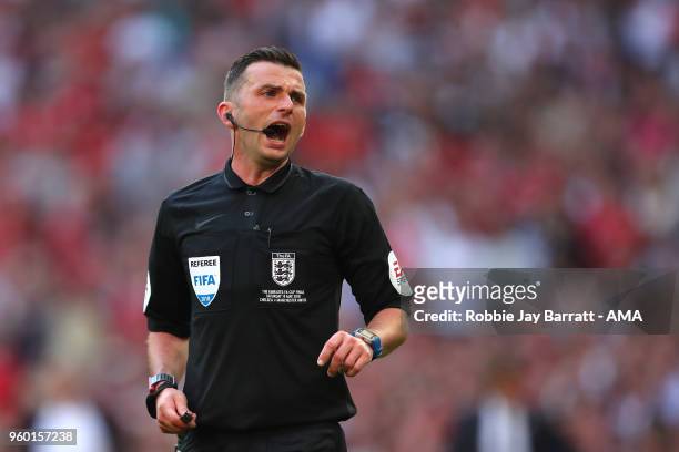 Referee Michael Oliver looks on during the Emirates FA Cup Final between Chelsea and Manchester United at Wembley Stadium on May 19, 2018 in London,...