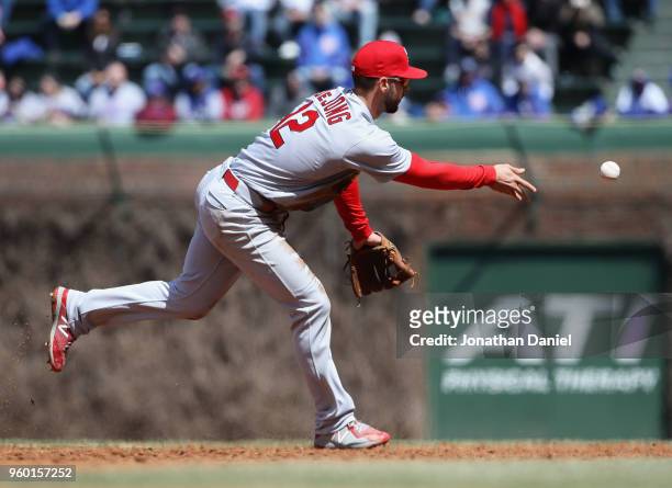 Paul DeJong of the St. Louis Cardinals tosses the ball to second base against the Chicago Cubs at Wrigley Field on April 19, 2018 in Chicago,...