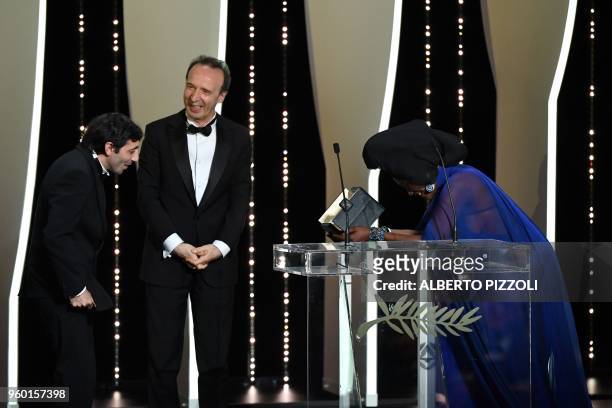 Italian actor Marcello Fonte receives the Best Actor Prize for his part in the film "Dogman" from Burundian singer and member of the Feature Film...