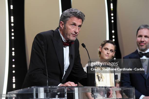 Jury member Kristen Stewart and Denis Villeneuve look as Director Pawel Pawlikowski receives the Best Director award for 'Cold War' on stage during...