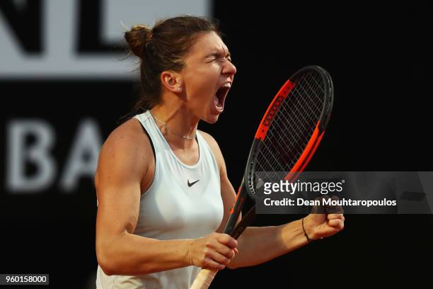 Simona Halep of Romania celebrates victory after winning her semi final match against Maria Sharapova of Russia during day 7 of the Internazionali...