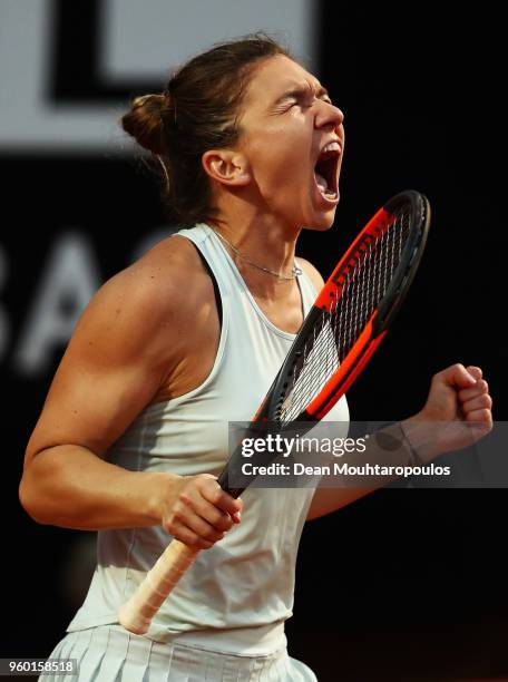 Simona Halep of Romania celebrates victory after winning her semi final match against Maria Sharapova of Russia during day 7 of the Internazionali...