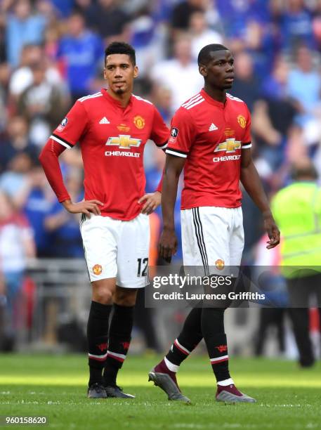 Paul Pogba of Manchester United and Chris Smalling of Manchester United look dejected following The Emirates FA Cup Final between Chelsea and...