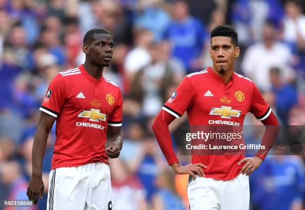 Paul Pogba of Manchester United and Chris Smalling of Manchester United look dejected following The Emirates FA Cup Final between Chelsea and...