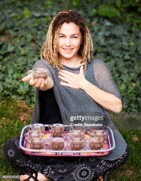 woman serving ceremonial cacao drink - renphoto stock pictures, royalty-free photos & images