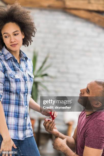 african american woman rejecting her boyfriend's proposal at home. - black women engagement rings imagens e fotografias de stock