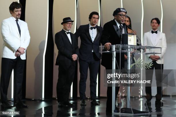 Director Spike Lee delivers a speech on stage after he was awarded with the Grand Prix for the film "BlacKkKlansman", as US-Puerto Rican actor and...