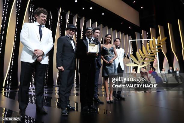 Director Spike Lee poses on stage after he was awarded with the Grand Prix for the film "BlacKkKlansman", as US-Puerto Rican actor and President of...