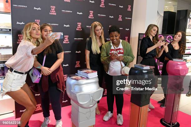 Mrs Bella, Tatjana Mariposa and Lisa-Marie Schiffner during the 'Kiss Me Karl Limited Edition' Launch at Douglas Store on May 19, 2018 in Berlin,...