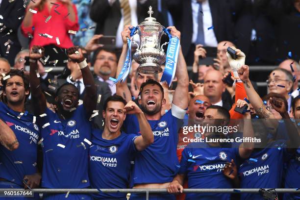 Gary Cahill of Chelsea lifts the Emirates FA Cup trophy following his sides victory in The Emirates FA Cup Final between Chelsea and Manchester...