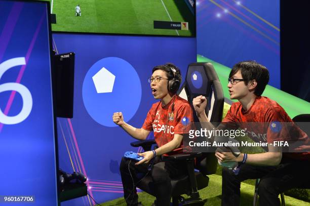 Shota Sato aka TSAKT and Subaru Sagano aka SUBARUMIKIW of BU eSports react during the FIFA eClub World Cup - Day 1 on May 19, 2018 in Paris, France.