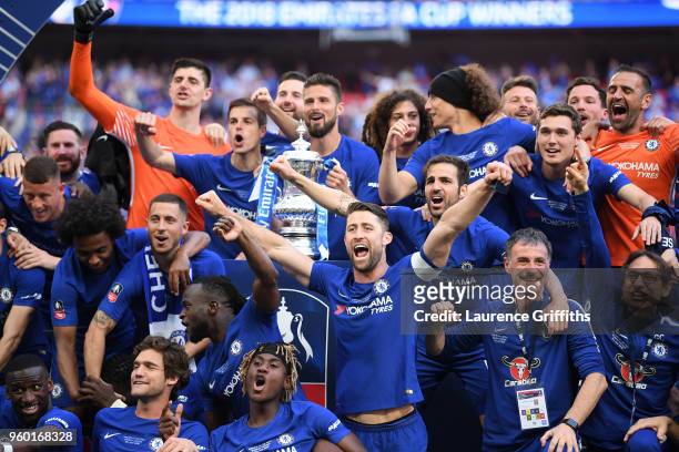 Olivier Giroud of Chelsea holds the Emirates FA Cup trophy in celebration of his side's win, with team mates following The Emirates FA Cup Final...