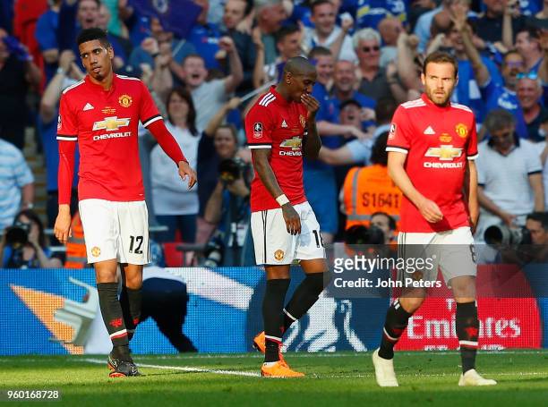Chris Smalling, Ashley Young and Juan Mata of Manchester United show their disappointment during the Emirates FA Cup Final match between Manchester...