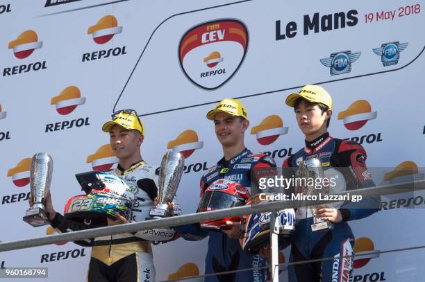 Raul Fernadez of Spain and Angel Nieto Team, Alex Viu of Spain and Marinelli Sniper Team and Ai Ogura of Japan and Asia Talent Team pose on the...