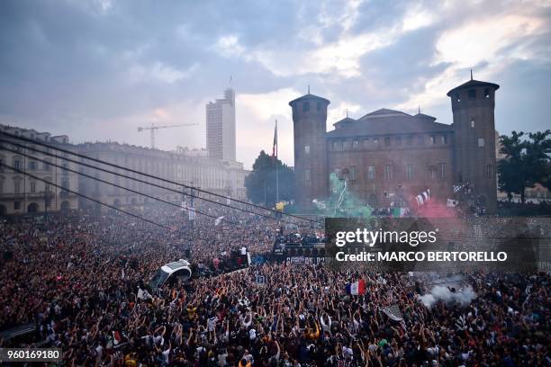 Juventus' players parade aboard an open-top bus to celebrate the "scudetto" with supporters in central Turin after the Italian Serie A last football...