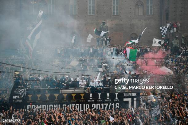 Juventus' players parade aboard an open-top bus to celebrate the "scudetto" with supporters in central Turin after the Italian Serie A last football...