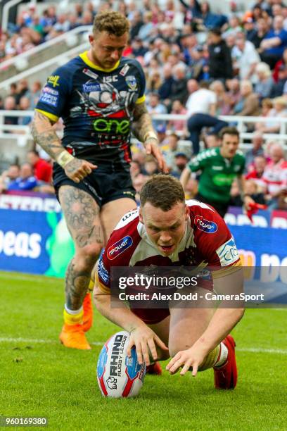 Wigan Warriors' Liam Marshall scores his side's fifth try during the Betfred Super League Round 15 match between Wigan Warriors and Warrington Wolves...
