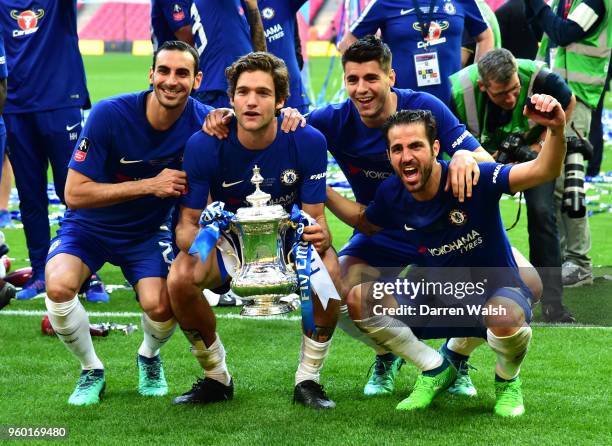 Davide Zappacosta, Marcos Alonso, Alvaro Morata and Cesc Fabregas of Chelsea celebrate their victory with the Emirates FA Cup trophy following The...