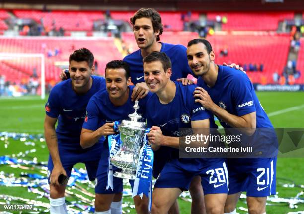 Alvaro Morata, Pedro, Marcos Alonso, Cesar Azpilicueta, and Davide Zappacosta of Chelsea pose with the Emirates FA Cup Trophy following their sides...