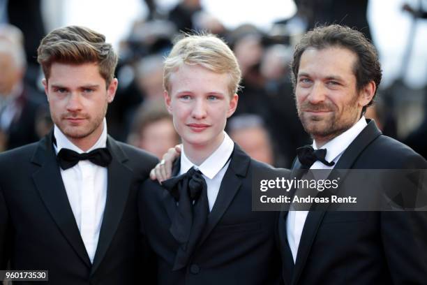 Un Certain Regard winner for best Director Lukas Dhont, and best actor Victor Polster stand with co-star actor Arieh Worthalter at the Closing...