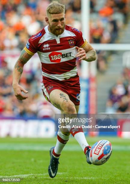 Wigan Warriors' Sam Tomkins kicks a grubber during the Betfred Super League Round 15 match between Wigan Warriors and Warrington Wolves at St James'...