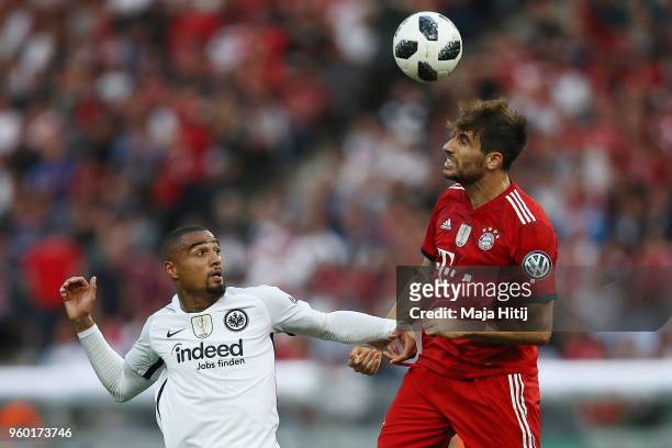 Kevin Prince-Boateng of Frankfurt fights for the ball with Javi Martinez of Bayern Muenchen during the DFB Cup final between Bayern Muenchen and...