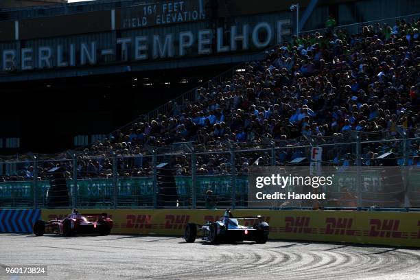 In this handout provided by FIA Formula E, Jrme d'Ambrosio , Dragon Racing, Penske EV-2, leads Mitch Evans , Panasonic Jaguar Racing, Jaguar I-Type...