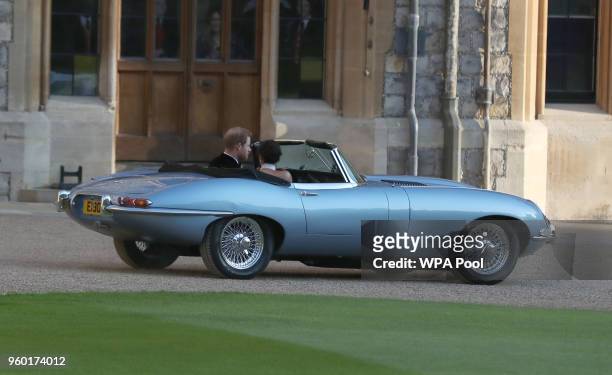 Duchess of Sussex and Prince Harry, Duke of Sussex leave Windsor Castle by car after their wedding to attend an evening reception at Frogmore House,...