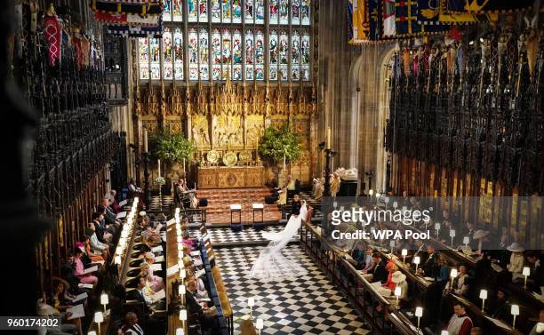 Prince Harry and Meghan Markle stand at the altar at St George's Chapel on May 19, 2018 in Windsor, England.