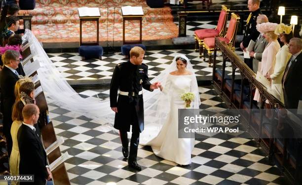 Prince Harry, Duke of Sussex and The Duchess of Sussex leave following their wedding ceremony in St George's Chapel at Windsor Castle on May 19, 2018...