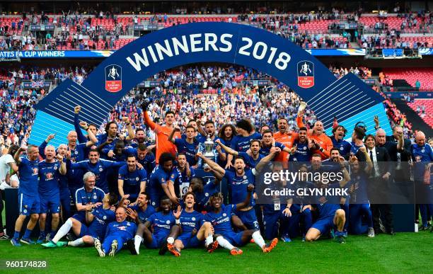 Chelsea players celebrate with the trophy after their victory in the English FA Cup final football match between Chelsea and Manchester United at...