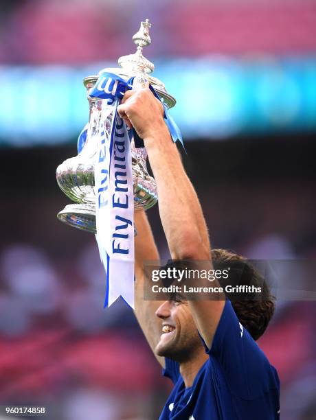 Marcos Alonso of Chelsea lifts the Emirates FA Cup trophy following his side's win during The Emirates FA Cup Final between Chelsea and Manchester...