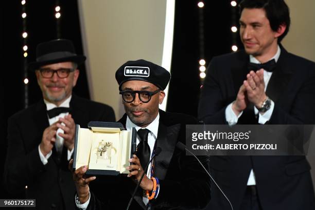Director Spike Lee poses on stage on May 19, 2018 after he was awarded with the Grand Prix for the film "BlacKkKlansman" during the closing ceremony...