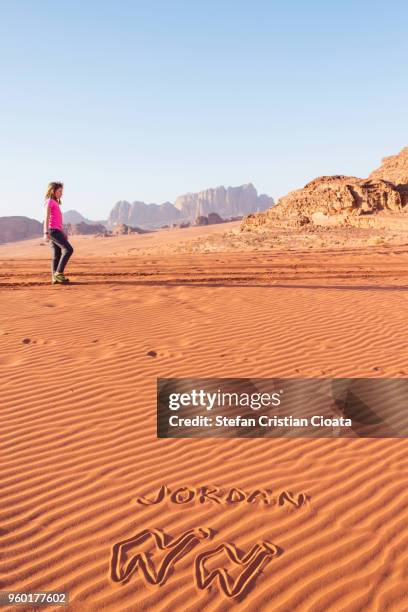 girl walking in wadi rum desert jordan - hot middle eastern girls stock-fotos und bilder