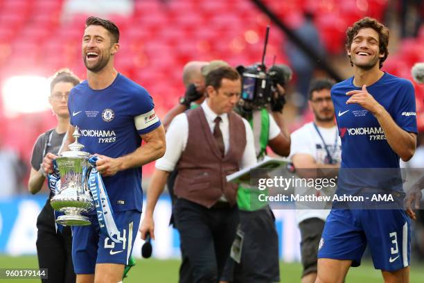 Gary Cahill of Chelsea celebrates with the trophy and his team-mate Marcos Alonso at the end of the Emirates FA Cup Final between Chelsea and...