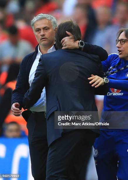 Antonio Conte manager of Chelsea is embraced by Jose Mourinho manager of Manchester United during The Emirates FA Cup Final between Chelsea and...