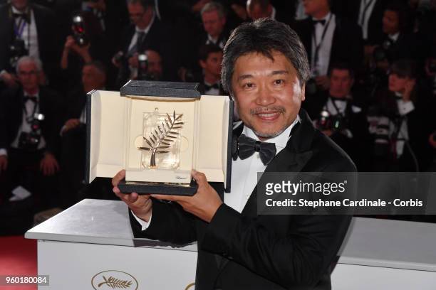 Director Hirokazu Koreeda poses with the Palme d'Or award for 'Shoplifters' at the photocall the Palme D'Or Winner during the 71st annual Cannes Film...