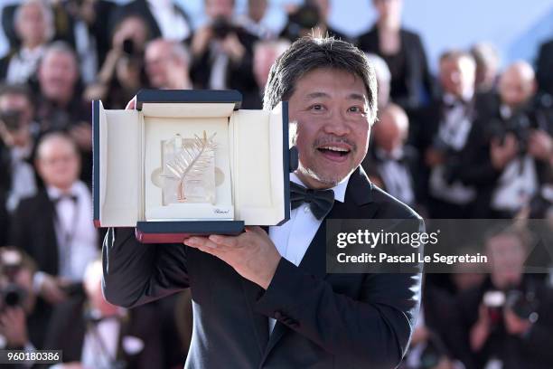 Director Hirokazu Koreeda poses with the Palme d'Or award for 'Shoplifters' at the photocall the Palme D'Or Winner during the 71st annual Cannes Film...