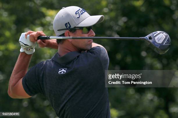 Adam Scott of Australia plays his tee shot on the seventh hole during the third round of the AT&T Byron Nelson at Trinity Forest Golf Club on May 19,...