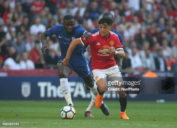 Manchester United's Alexis Sanchez and Chelsea's Antonio Rudiger during the The Emirates FA Cup Final match between Chelsea and Manchester United at...