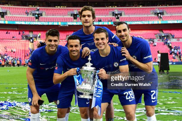 Alvaro Morata, Pedro, Marcos Alonso, Cesar Azpilicueta, and Davide Zappacosta of Chelsea pose with the Emirates FA Cup Trophy following their sides...