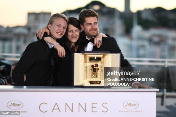 Swiss director and President of the Camera d'Or jury Ursula Meier poses with Belgian director Lukas Dhont and Belgian actor Victor Polster on May 19,...