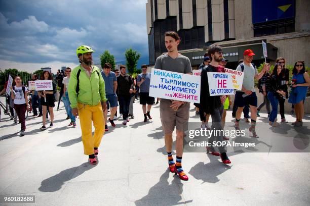 Men wore high-heeled shoes and walked around the park in front of the National Palace of Culture in Sofia to show solidarity with women and the...
