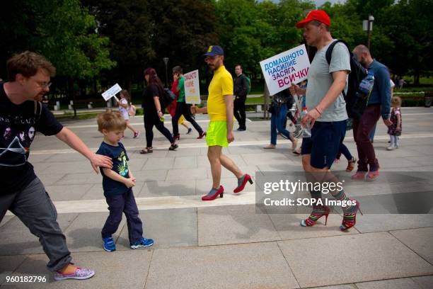 Men wore high-heeled shoes and walked in the center of Sofia in order to show solidarity with women and the struggles they face during the "Walk a...