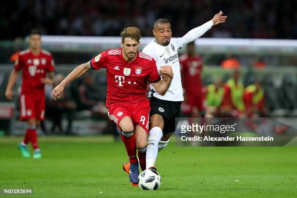 Kevin-Prince Boateng of Eintracht Frankfurt is challenged by Javier Martinez of Bayern Muenchen during the DFB Cup final between Bayern Muenchen and...