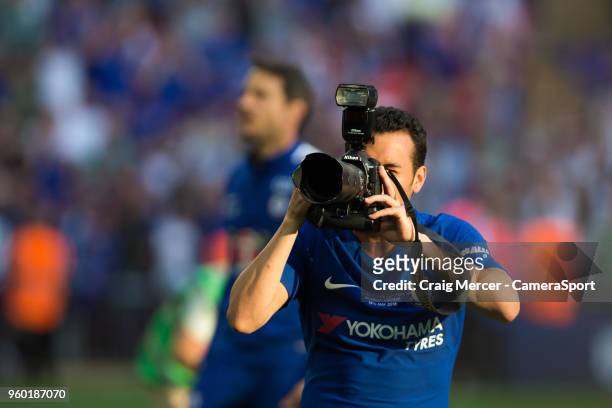Chelsea's Pedro plays with a photographers camera during the celebrations after the Emirates FA Cup Final match between Chelsea and Manchester United...