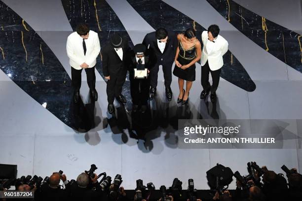 Director Spike Lee poses on stage after he was awarded with the Grand Prix for the film "BlacKkKlansman", as US-Puerto Rican actor and President of...