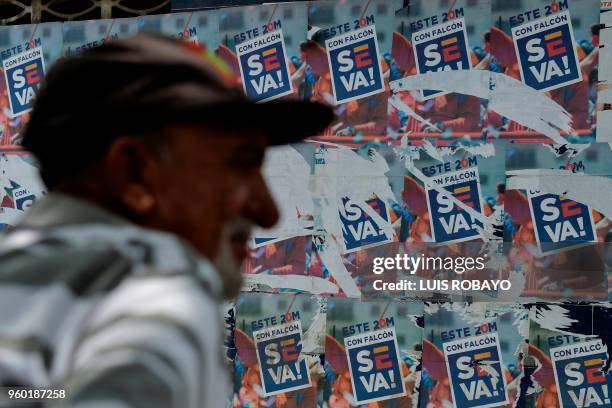 Posters in support of Venezuelan opposition presidential candidate Henri Falcon are seen in Barquisimeto, Venezuela, on May 19, 2018 on the eve of...