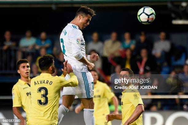 Real Madrid's Portuguese forward Cristiano Ronaldo scores a header during the Spanish league football match between Villarreal CF and Real Madrid CF...